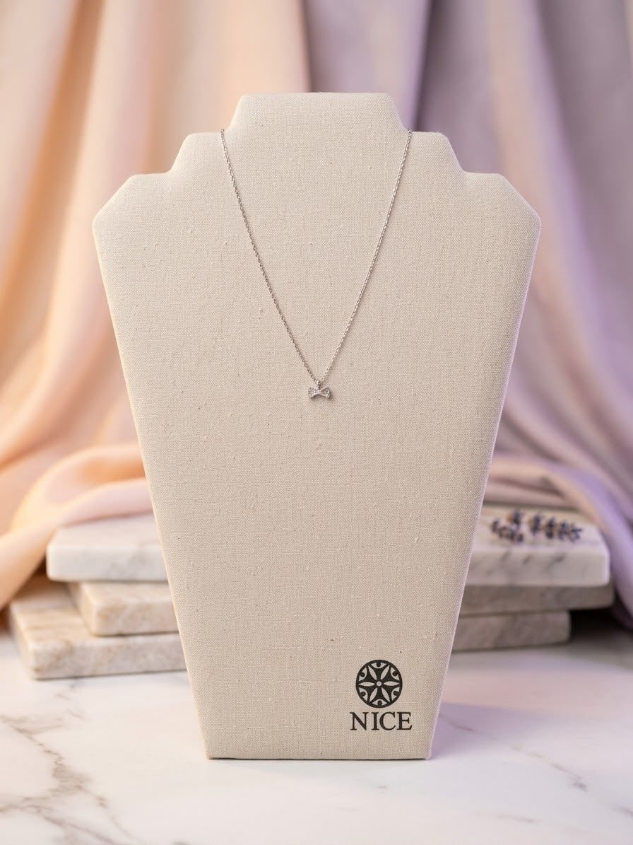 Collar dije moño platino